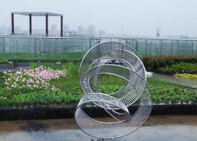不锈钢镂空盘旋抽象滑梯雕塑